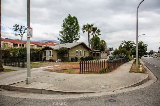 ranch-style home with a fenced front yard