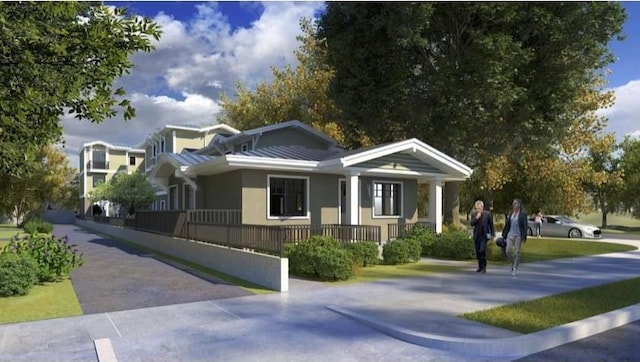 exterior space featuring covered porch and metal roof