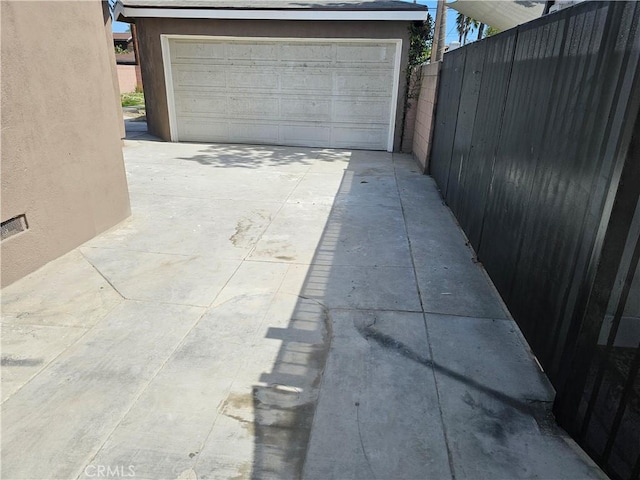 garage featuring fence