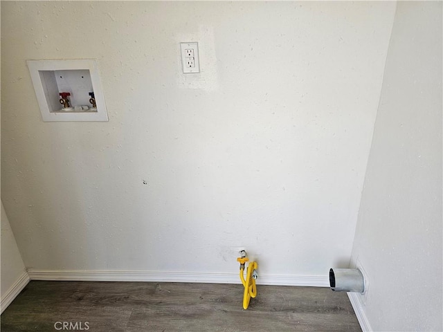 laundry room featuring laundry area, hookup for a washing machine, baseboards, and wood finished floors