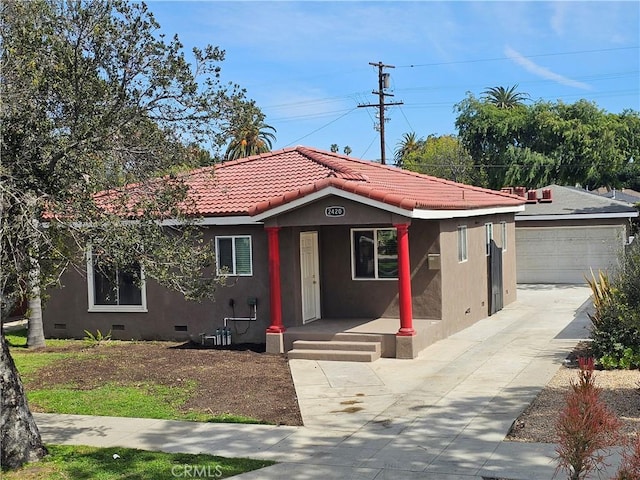 view of front of property with a tiled roof, crawl space, and stucco siding