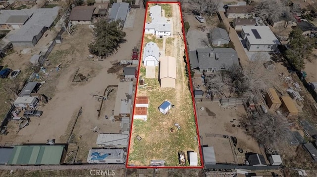 birds eye view of property with a residential view