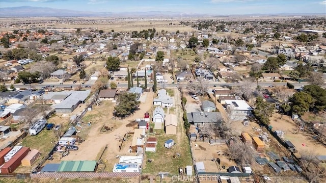 birds eye view of property with a residential view, a mountain view, and a desert view