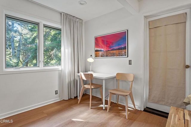 office featuring baseboards and wood finished floors