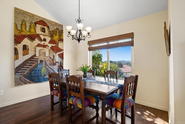 dining space featuring baseboards, dark wood-style flooring, and a chandelier