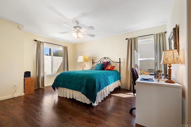 bedroom featuring dark wood-style floors, ceiling fan, and baseboards