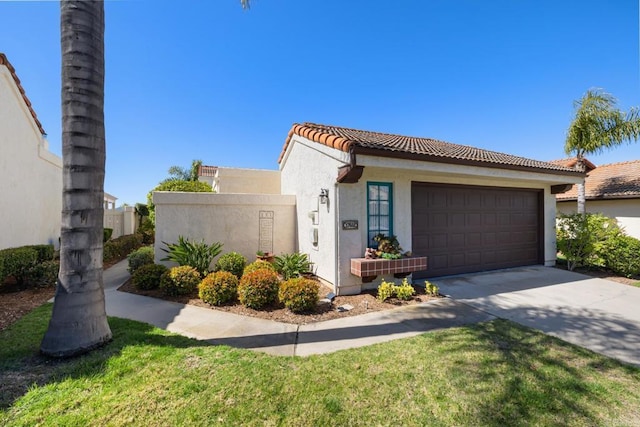 view of front of house featuring stucco siding, fence, a garage, and a tile roof