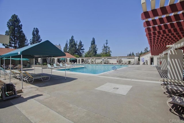 community pool featuring a patio area