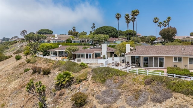 31711 Crystal Sands Dr, Laguna Niguel, CA 92677 - rear view of house featuring a residential view and a chimney