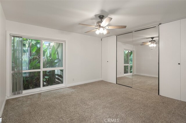 31711 Crystal Sands Dr, Laguna Niguel, CA 92677 - unfurnished bedroom featuring multiple windows, carpet, and ceiling fan