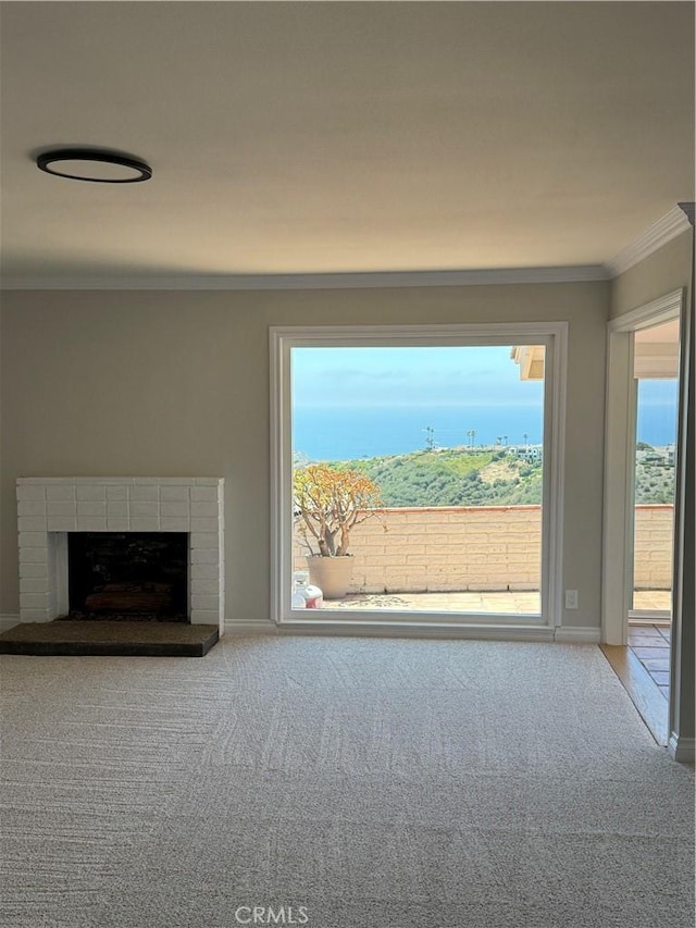 31711 Crystal Sands Dr, Laguna Niguel, CA 92677 - unfurnished living room featuring ornamental molding, carpet floors, and a fireplace