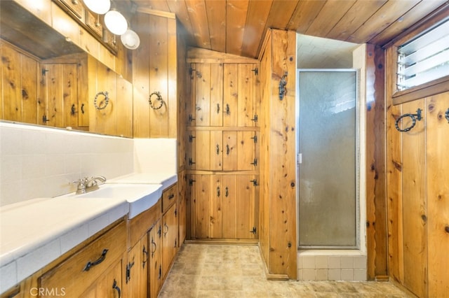 full bath featuring wooden walls, wood ceiling, a stall shower, and vanity