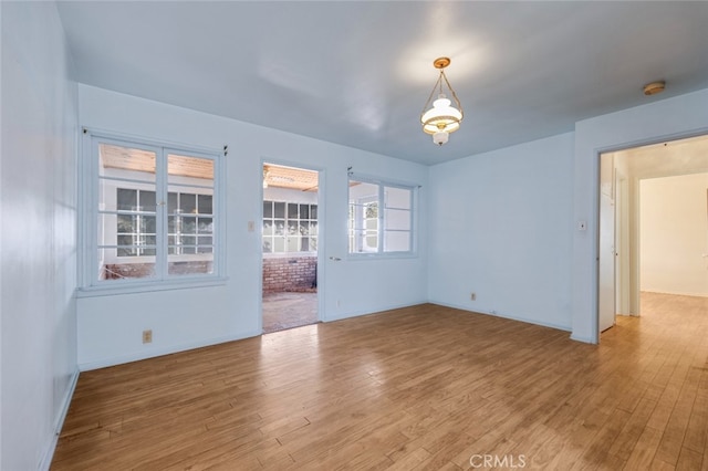 spare room with light wood finished floors