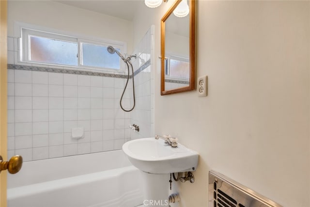 bathroom with a sink and shower / bath combination