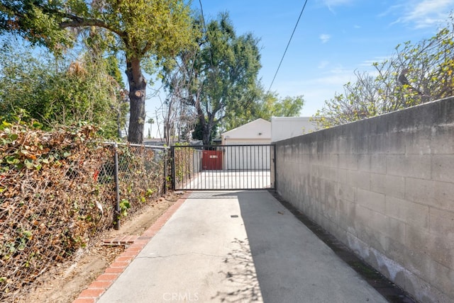 view of gate featuring fence