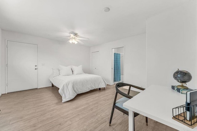 bedroom with light wood finished floors and ceiling fan