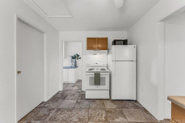 kitchen featuring under cabinet range hood, baseboards, white appliances, and brown cabinetry