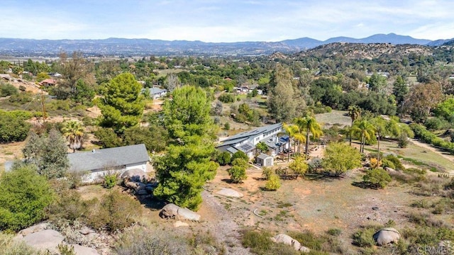 birds eye view of property with a mountain view