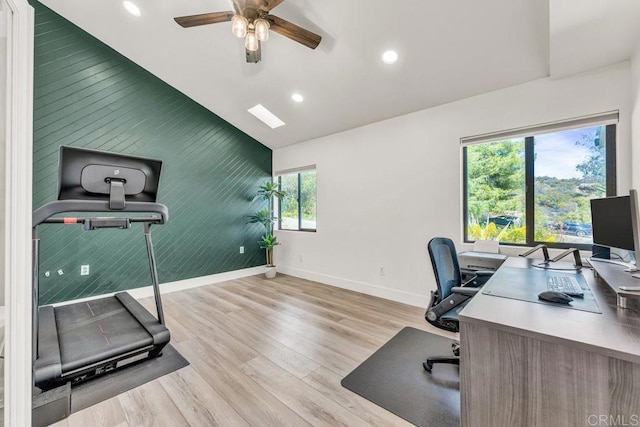 home office featuring baseboards, vaulted ceiling, recessed lighting, wood finished floors, and a ceiling fan