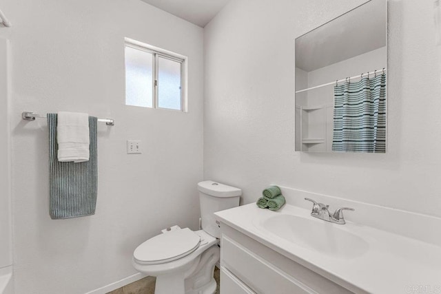 bathroom with vanity, toilet, and a shower with curtain