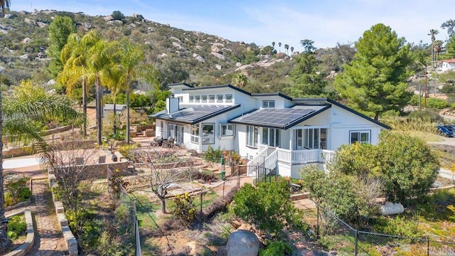 view of front of house featuring solar panels