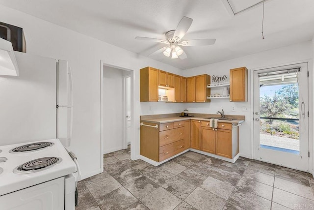 kitchen with a sink, open shelves, white appliances, light countertops, and baseboards