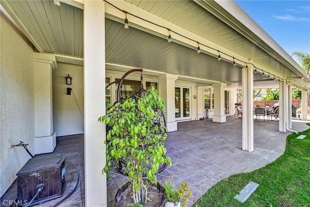 view of patio featuring fence