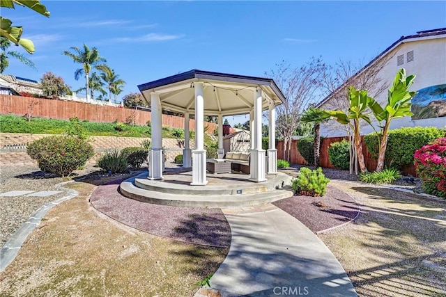 exterior space with a gazebo, a patio area, and a fenced backyard