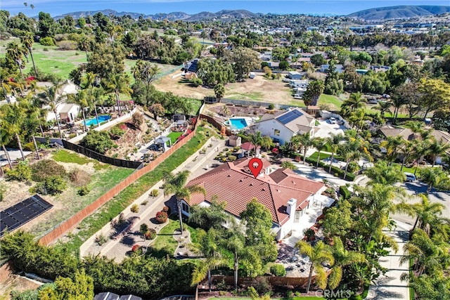 birds eye view of property with a mountain view