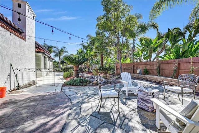 view of patio / terrace featuring fence