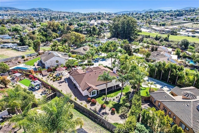 birds eye view of property with a residential view and a mountain view