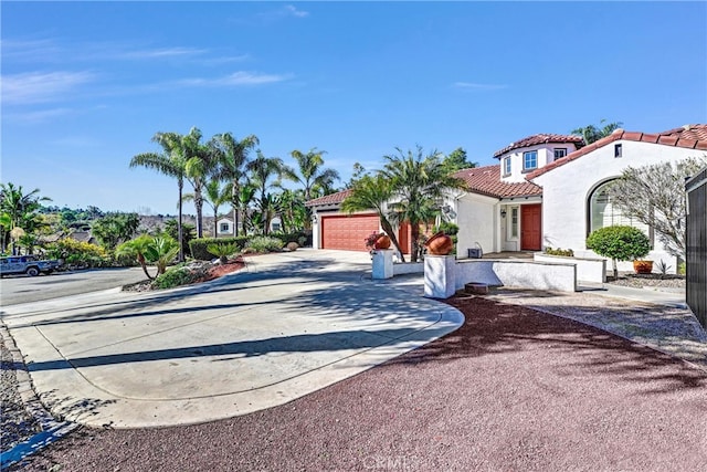 view of street with concrete driveway