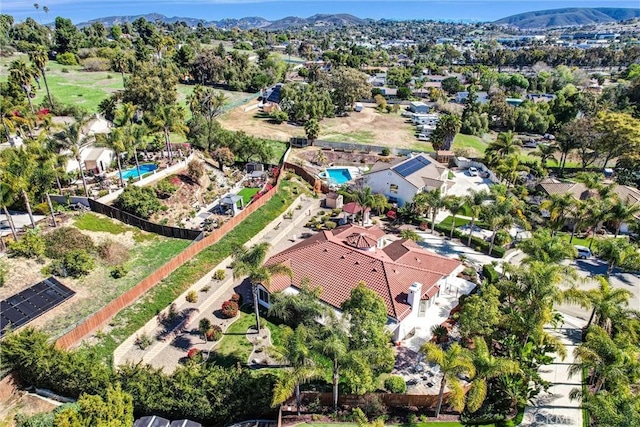 drone / aerial view featuring a mountain view