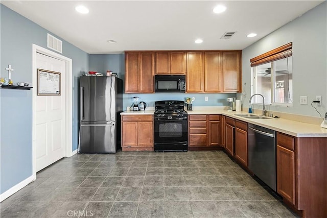 kitchen with a sink, visible vents, black appliances, and recessed lighting