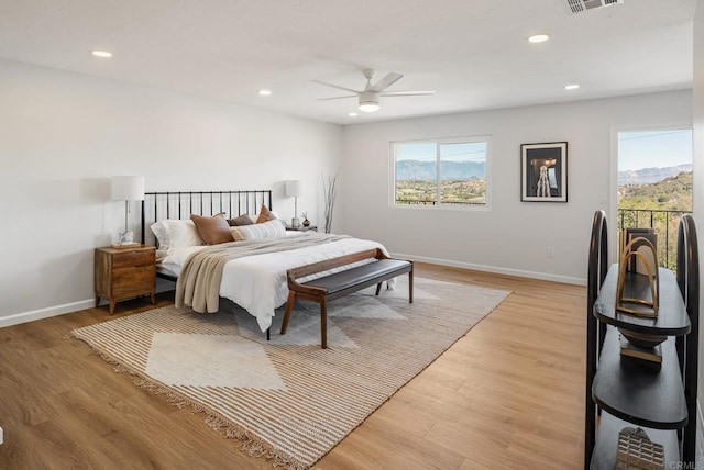 bedroom featuring recessed lighting, light wood-type flooring, and baseboards