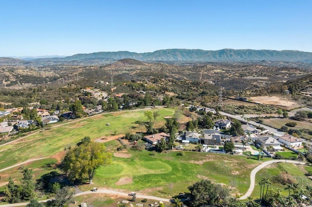 bird's eye view with a residential view, a mountain view, and view of golf course