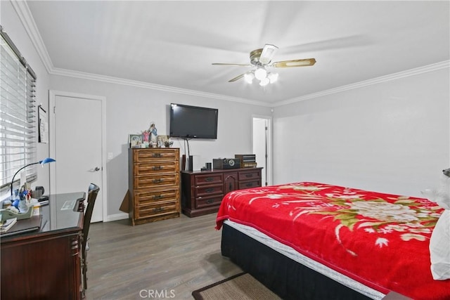 bedroom with a ceiling fan, wood finished floors, and ornamental molding