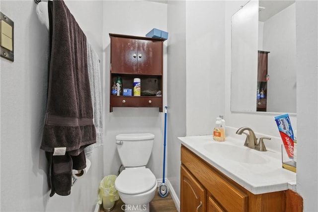 bathroom with toilet and vanity