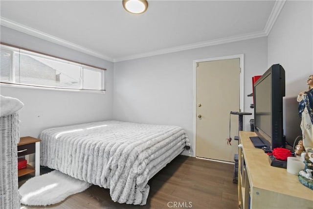 bedroom with dark wood-style floors and ornamental molding