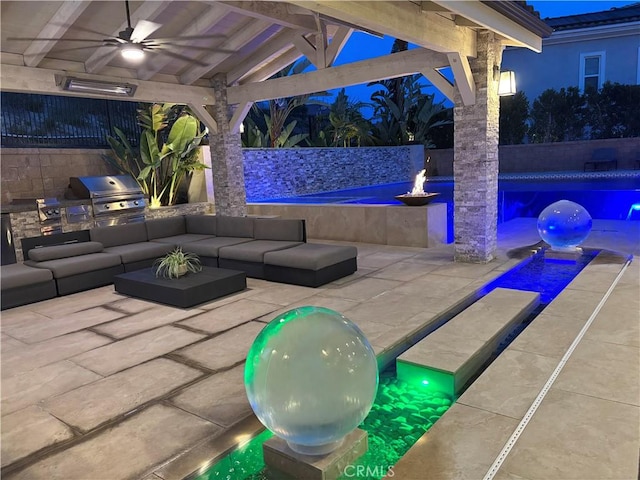 view of patio / terrace featuring a ceiling fan, an outdoor living space, a fenced backyard, a grill, and exterior kitchen