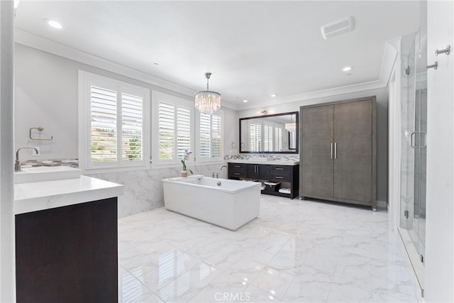 full bath featuring crown molding, a freestanding bath, a stall shower, marble finish floor, and vanity