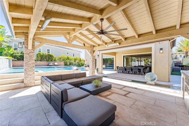 view of patio featuring outdoor lounge area, a ceiling fan, and an outdoor pool