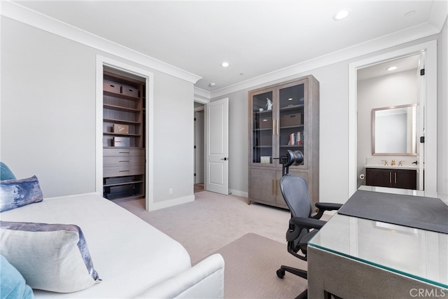 office area featuring crown molding, baseboards, light carpet, recessed lighting, and a sink