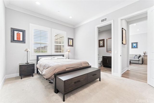 bedroom featuring ornamental molding, baseboards, visible vents, and light carpet