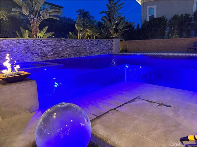 view of swimming pool featuring a patio area, a fenced backyard, and a fenced in pool