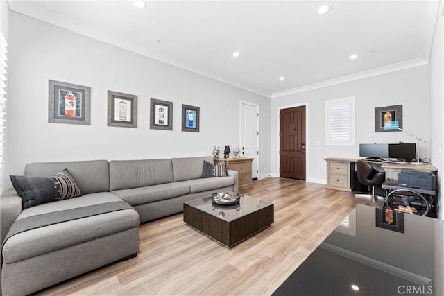 living room featuring recessed lighting, baseboards, ornamental molding, and light wood finished floors