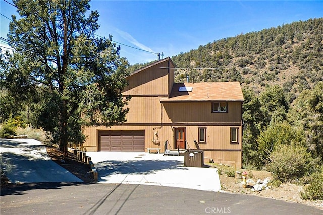 view of front of house with concrete driveway