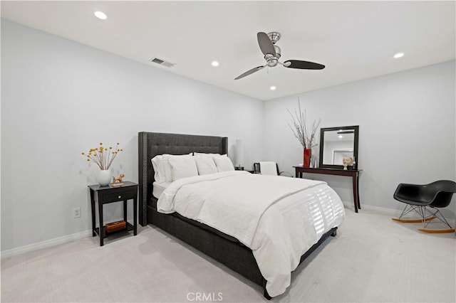 bedroom with recessed lighting, visible vents, light carpet, and baseboards