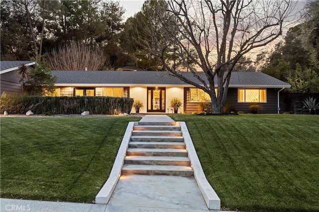 ranch-style home with a front yard