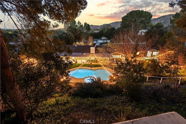 view of pool with a mountain view and a fenced in pool